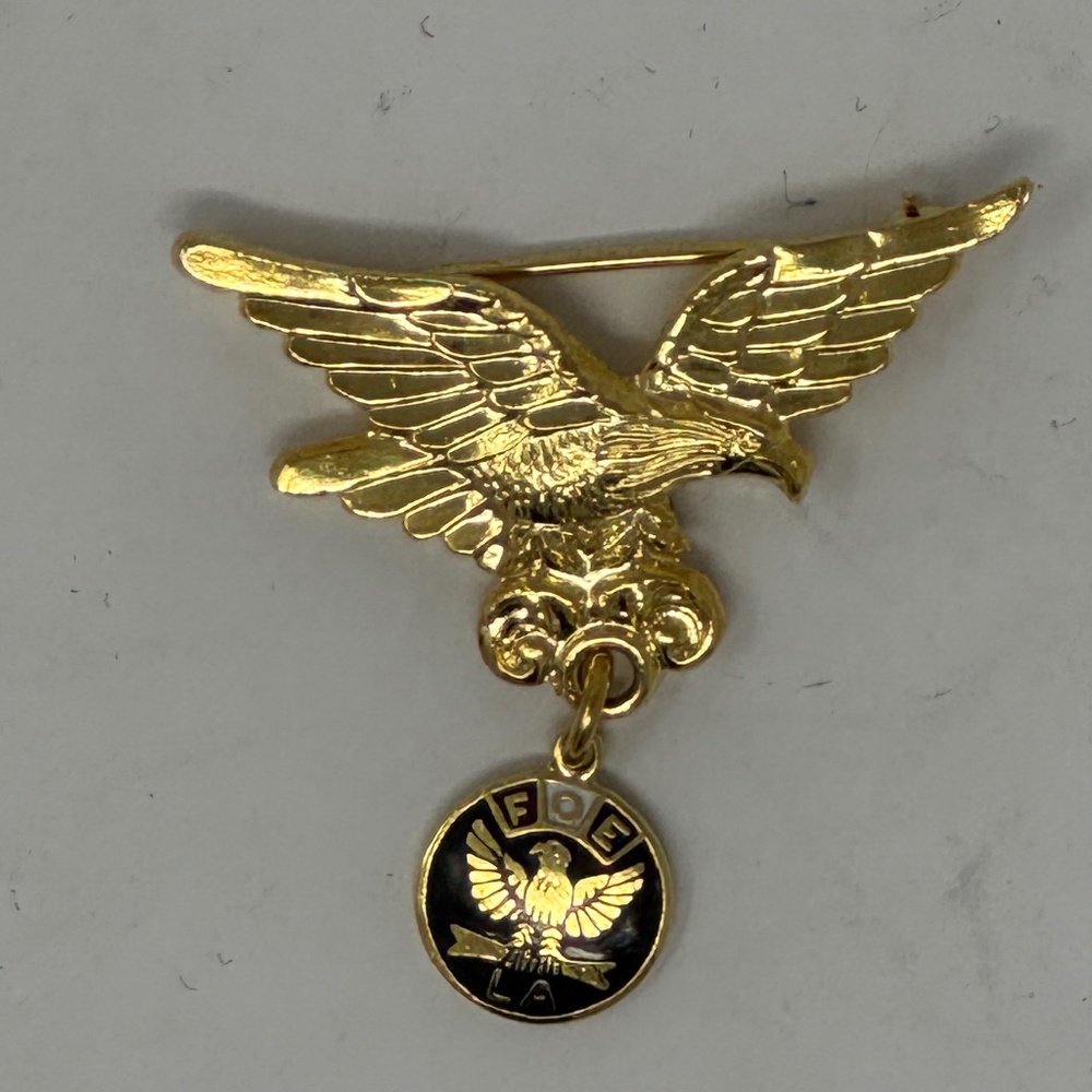Vintage Fraternal Order of the Eagles pin with dangling pendant.